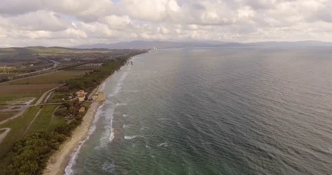 Aerial, a tower of a coastal fortification on the empty beach 스톡 동영상 86852813