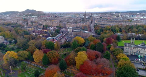 Aerial track from right to left above the Dean cemetery looking towards Stock Footage 256980792