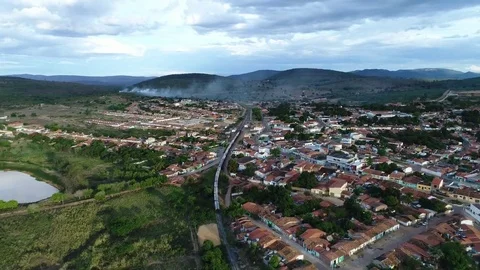 Aerial track of a train going through a rural town. 库存影片 73220960