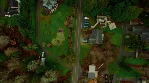 Aerial - Tracking a Cyclist Overhead Through Forested Neighborhood Stock Footage 91158554