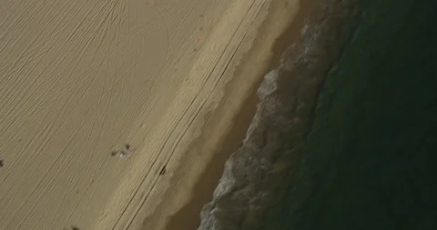 Aerial tracking down beach, day Stock Footage 105939041