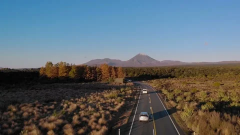 Aerial tracking down a highway towards Mt Ngauruhoe, central plateau, New Stock-Footage 153501927