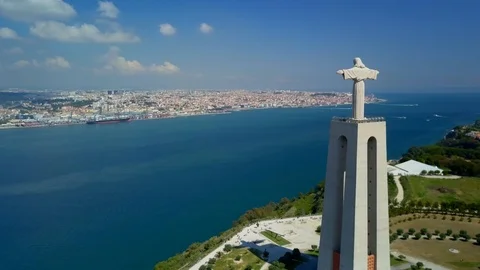 Aerial, tracking, drone shot, panning around the Cristo Rei monument, the Stock Footage 106942146