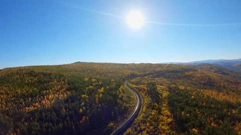 Aerial tracking of a freight train in the forest Stock Footage 122650125