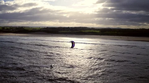 Aerial: tracking kitesurfer, dynamic drone, 4K Stock Footage 89270148