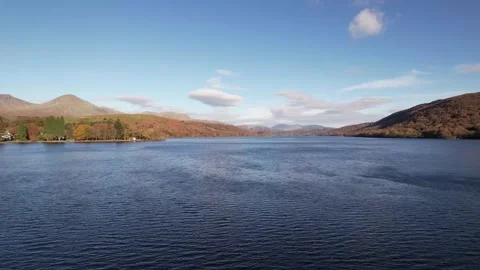 Aerial tracking over Coniston Water in autumn Lake District, England Stock Footage 336494414