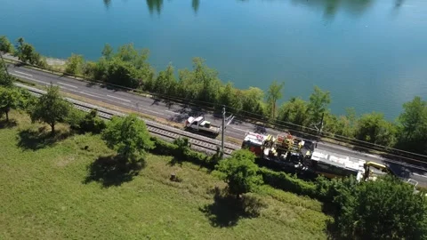Aerial tracking of an overhead line works train near Ernsthofen, Austria Video stock 343438076