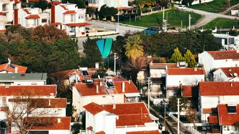 Aerial tracking of a paramotor flying over the sea with a drone Vídeo Stock 266391265