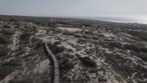 Aerial tracking path Guincho Beach Cascais Portugal sand dunes Cabo da Roca Stock Footage 194770671