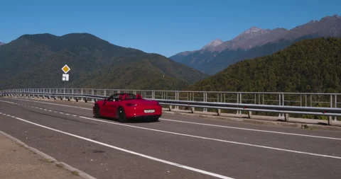 Aerial Tracking Red Open Car Winding Road Footage Stock Footage 160277229