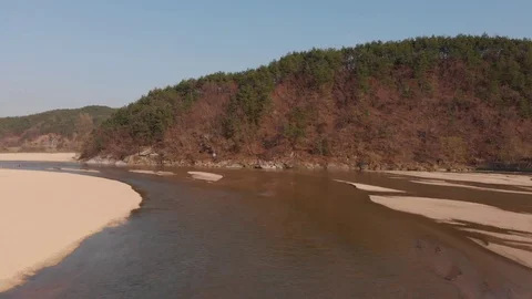 Aerial tracking river towards tiny wooden bridge Stock Footage 110961264