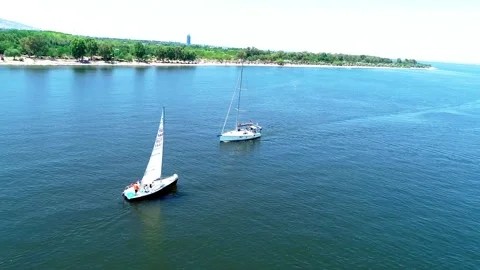 Aerial tracking of the sailing boat advancing in the Aegean Sea Stock Footage 243005239