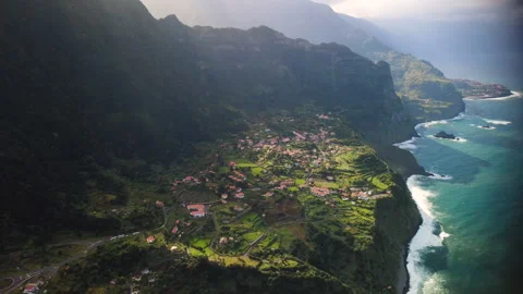 Aerial tracking shot of Arco de Sao Jorge village and coastline, Madeira Vídeos de archivo 328639286