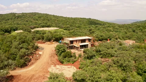 An aerial tracking shot of a building under construction Stock Footage 261049451