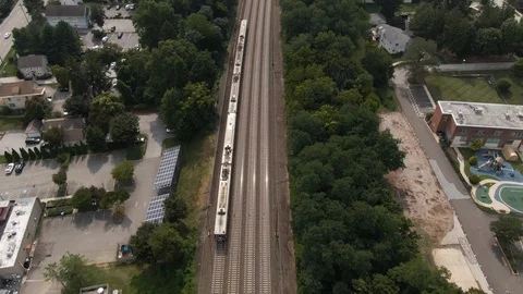 Aerial tracking shot of commuter train on the main line Philadelphia, PA Stock Footage 118978432