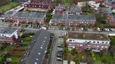 Aerial tracking shot of DPD German Parcel Service truck in modern neighborhood Stock Footage 297698570