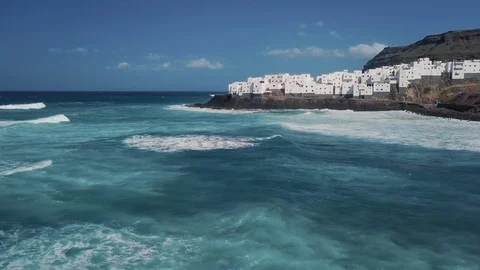 Aerial tracking shot forward over a costal Spanish town in Canary Islands 4K Video stock 101565802