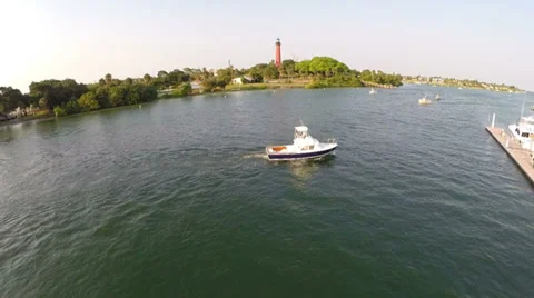 Aerial Tracking shot of the Jupiter Florida Inlet and Lighthouse Stock Footage