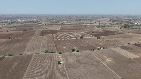 Aerial tracking shot mapping out a sprawling country layout of rural Stock Footage 337246064
