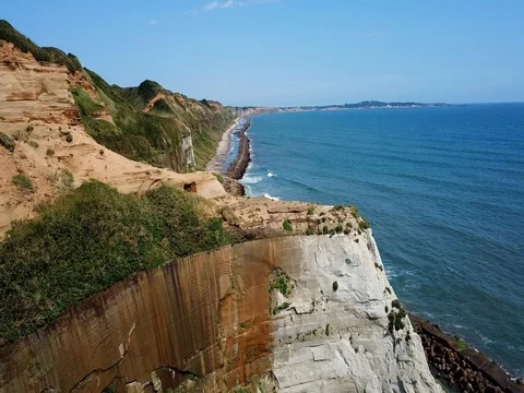 Aerial tracking shot of marine cliffs of Byobugaura Stock Footage 80077855