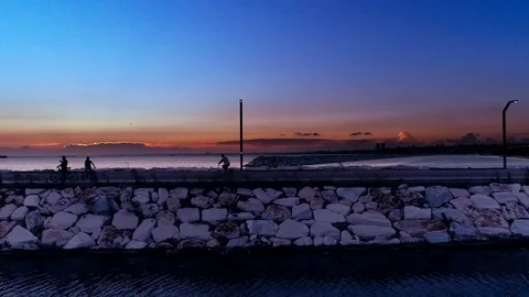 Aerial Tracking Shot of Middle Aged Man Cycling At Sunset Stock Footage 99692467