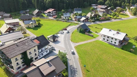Aerial tracking shot over alpine village houses and road in Gosau, Austria Stock-Footage 331300628