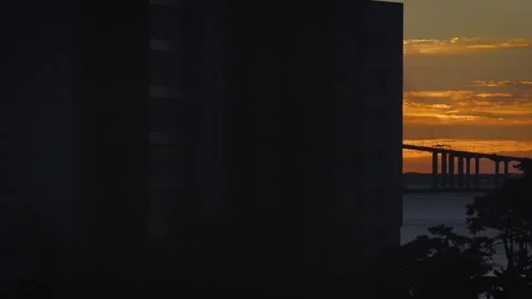 Aerial Tracking Shot of Plane Weaving Behind Buildings Near Incheon Bridge Video stock 345712256