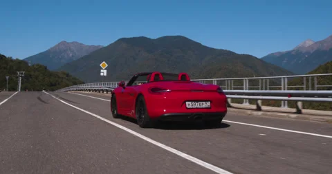 Aerial Tracking Shot Red Open Car Long Straight Road Stock Footage 160269894