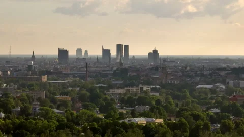 Aerial tracking shot of the skyline of Riga city, summer golden hour in Latvia Stock Footage 305233152