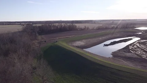 Aerial tracking a Side-by-Side ATV driving through farm Video stock 113522599