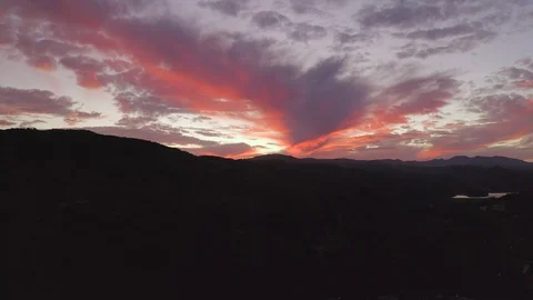 Aerial tracking sunset shot deep orange Stock Footage 127116611