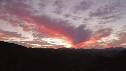 Aerial tracking sunset shot deep red Stock Footage 127119139