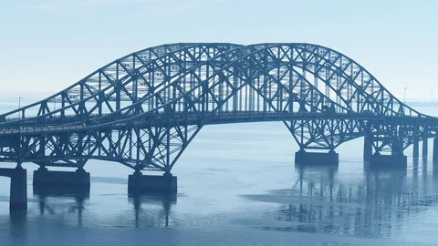 Aerial Tracking SUV over Bridge Stock Footage 128846319