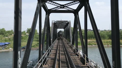 Aerial Tracking of Train Going Through Bridge | 4K Stock Footage 247586333