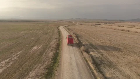 Aerial Tracking Van Driving Dwon the Road at Bardenas Reales Vídeos de archivo 103317708