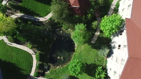 Aerial tracking video across grassfields Stock Footage 136484454