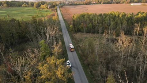 Aerial Tracking View of Emergency Fire Truck Vehicle Driving Fast along Stock Footage 210180547