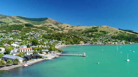 Aerial tracking view of harbour and waterfront at Akaroa,New Zealand Stock Footage 140658043