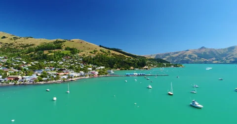 Aerial tracking view of harbour and waterfront at Akaroa,New Zealand Stock Footage 140670992