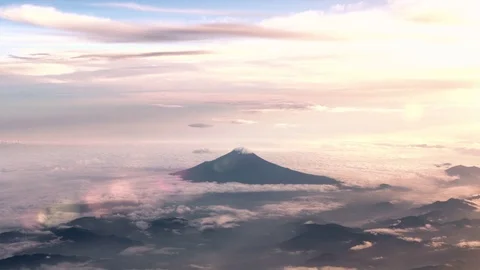 Aerial Tracking View of Mt Fuji covered in clouds at sunset Stock-Footage 71553280