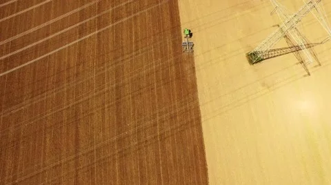 Aerial of a tractor on a acre in germany Stock Footage 67585361