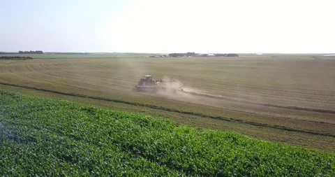 Aerial of Tractor and Rake (1) Stock Footage 221861554