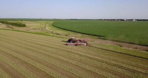 Aerial of Tractor and Rake (2) Stock Footage 221861562