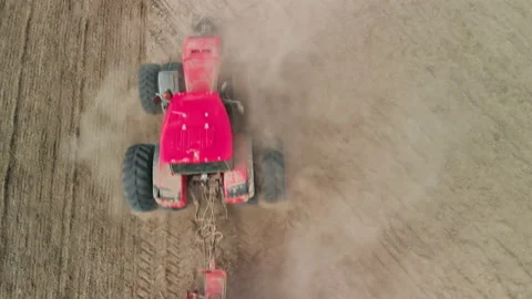 Aerial: tractor in conjunction with a sowing unit Video stock 155396381