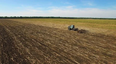 Aerial: Tractor plowing the soil Stock Footage 55070518