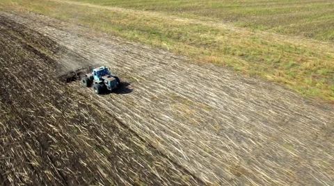 Aerial: Tractor plowing the soil Stock Footage 55095479