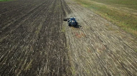 Aerial: Tractor plowing the soil Stock Footage 55101631