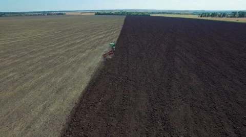 Aerial: Tractor plowing the soil Stock Footage 55436306