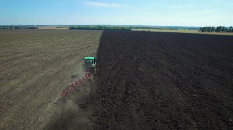 Aerial: Tractor plowing the soil Stock Footage 55436961