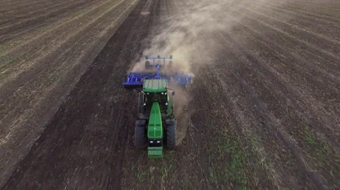 Aerial: Tractor plowing the soil on sunset Stock Footage 55808670